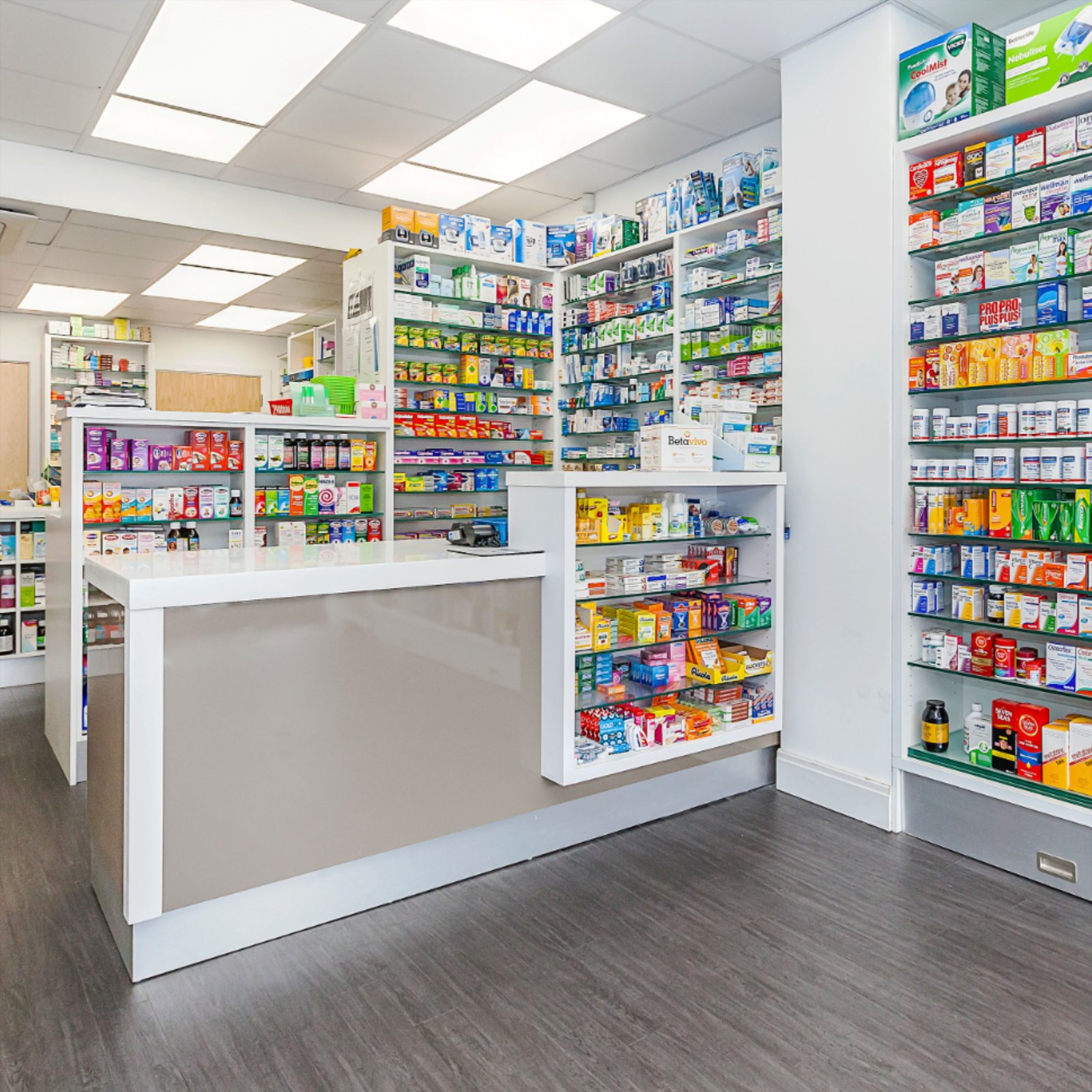 Pharmacy retail counter with medicine shelves